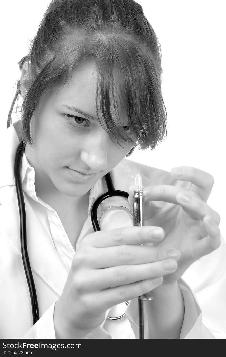 Young female doctor preparing an injection. Young female doctor preparing an injection