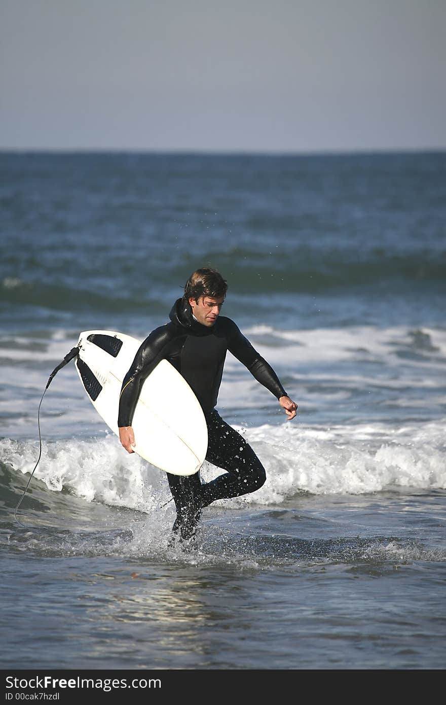 Surfer portrait holding a board