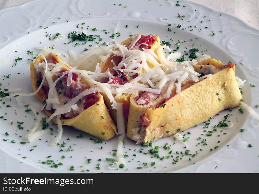 White dish in restaurant with tomato, italian pasta and cheese. White dish in restaurant with tomato, italian pasta and cheese