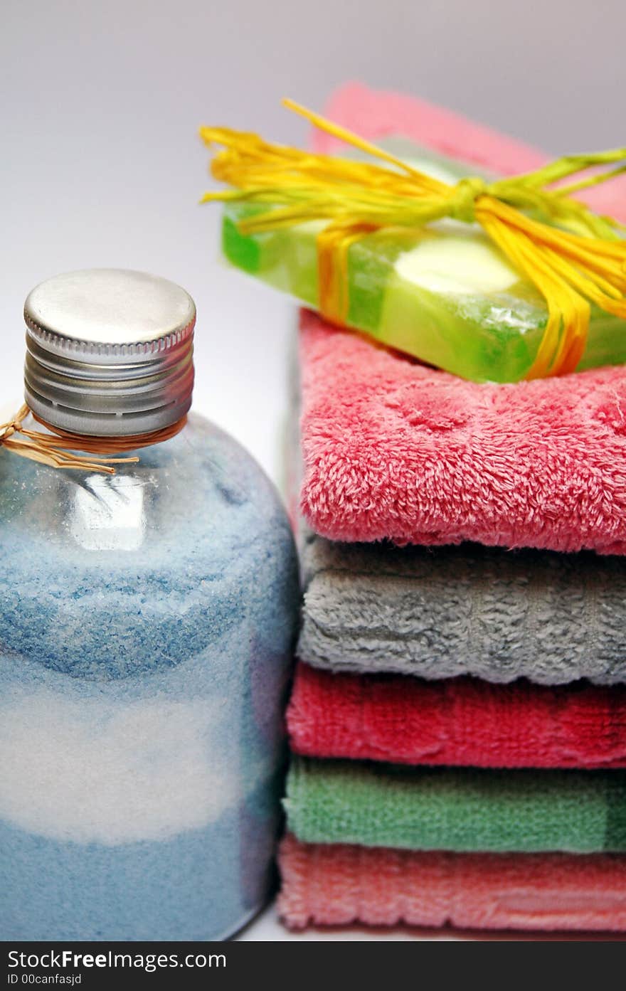 Bath towels of different colours piled on top of one another. Bath towels of different colours piled on top of one another