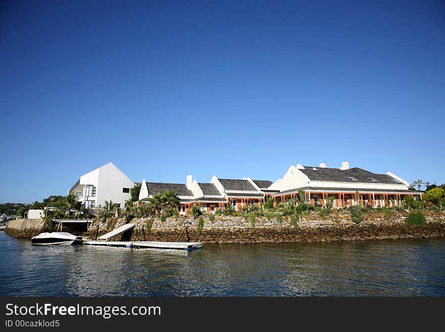 A big house build on side of the lagoon. A big house build on side of the lagoon