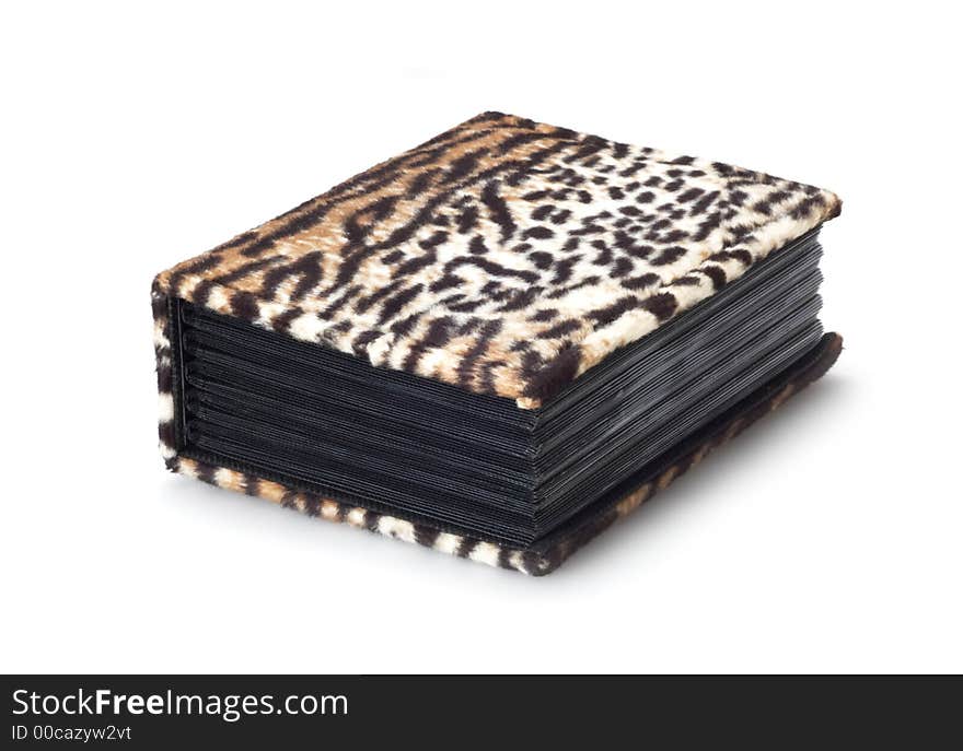 Photoalbum in leopard cover isolated on white