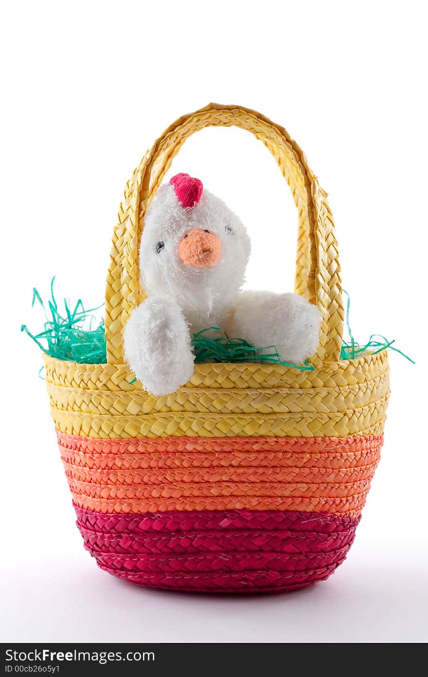 White chicken in colorful easter basket, isolated on white. White chicken in colorful easter basket, isolated on white