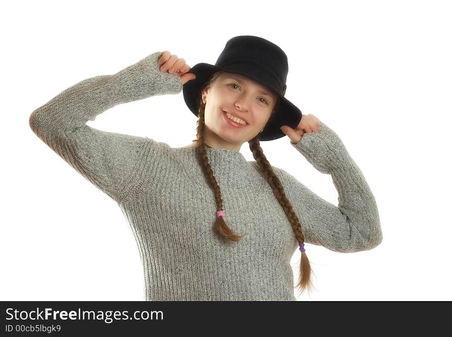 Charming young woman posing with a black hat. Charming young woman posing with a black hat