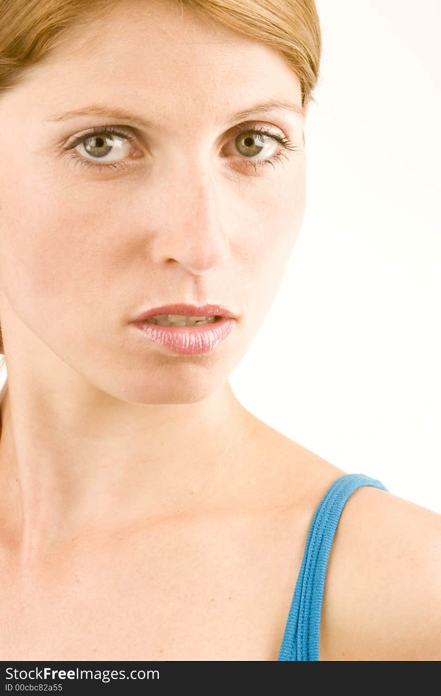 A portrait of a young woman against a plain background.