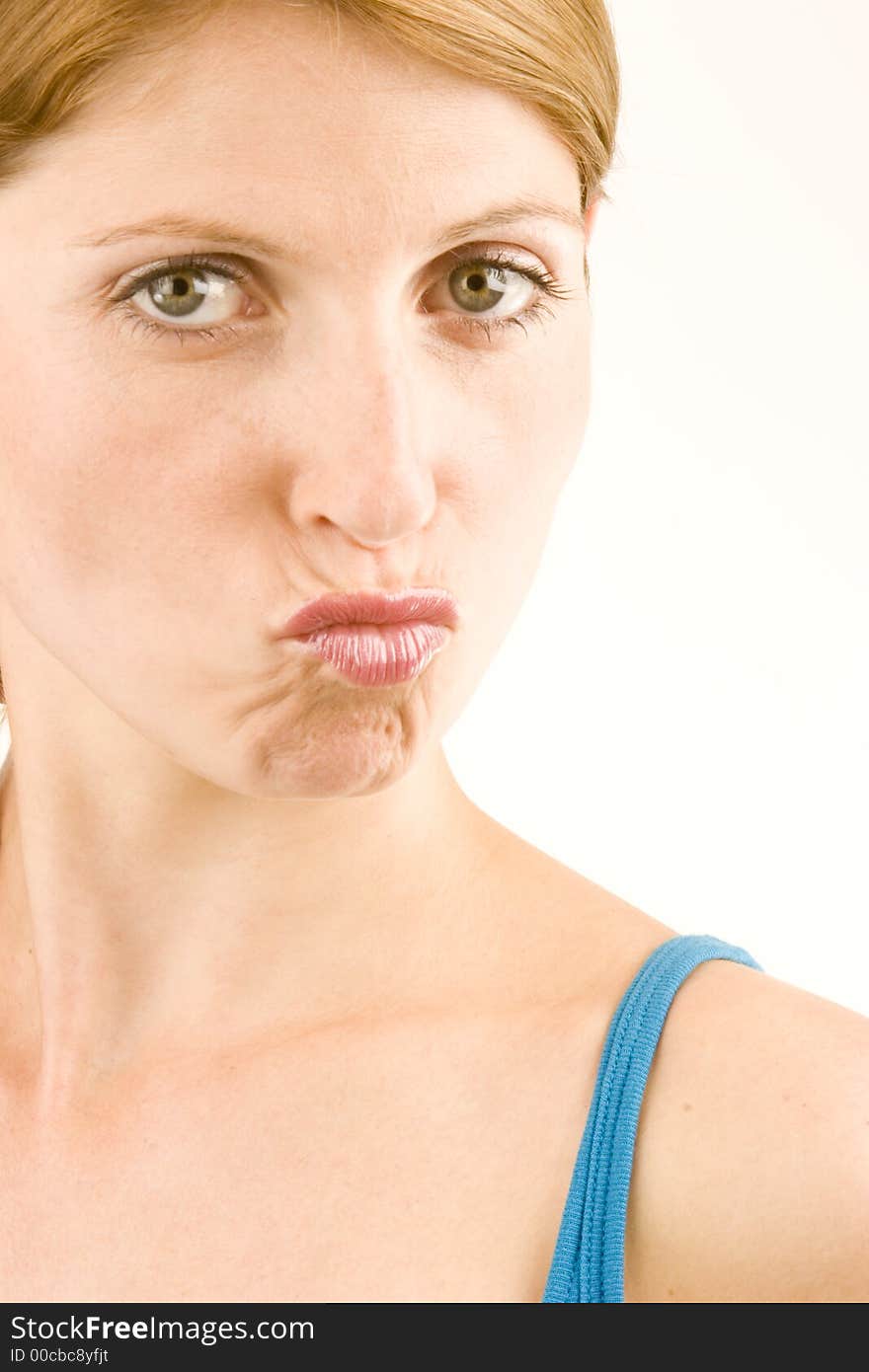 A portrait of a young woman against a plain background.