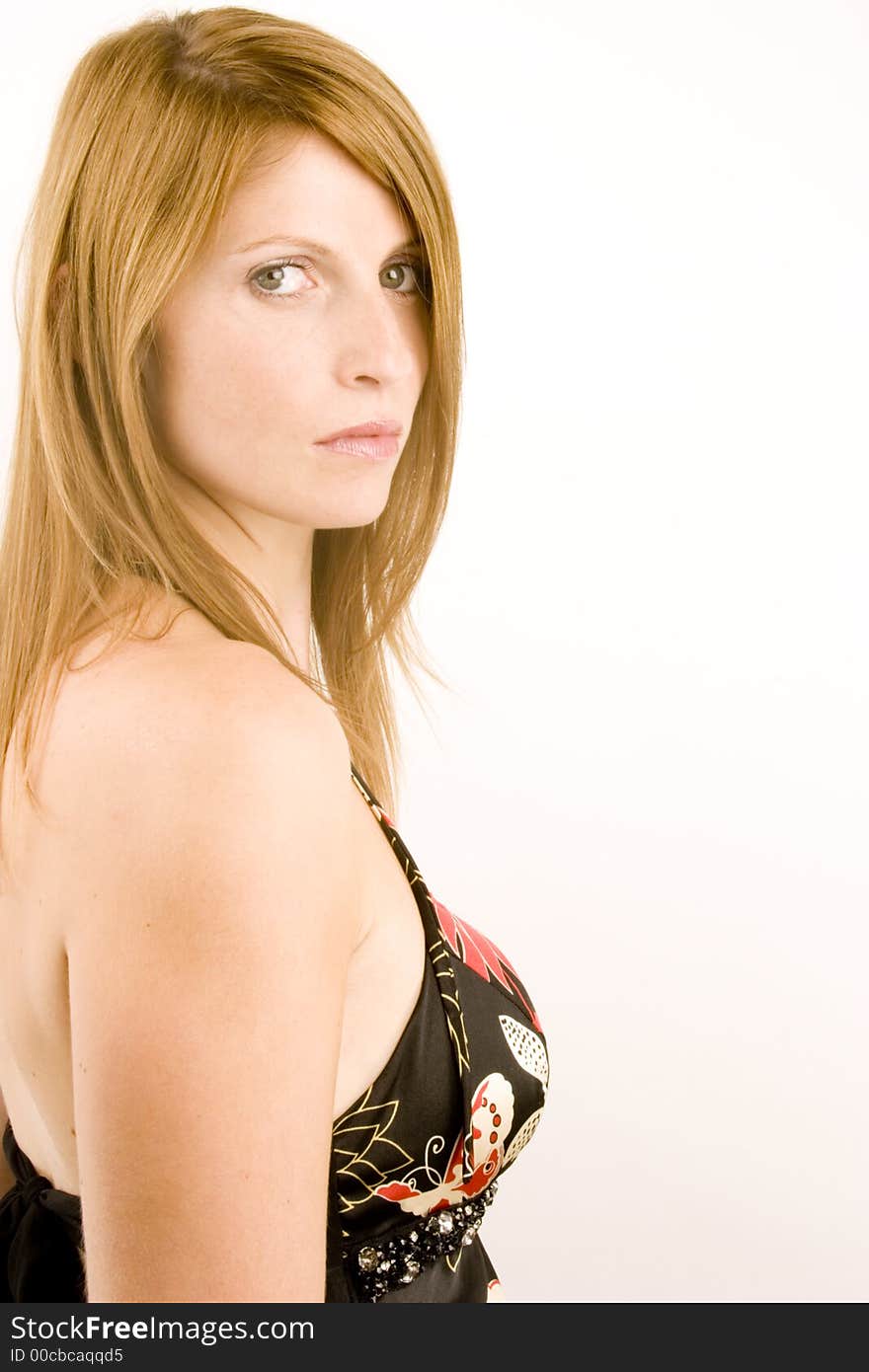 A portrait of a young woman against a plain background.