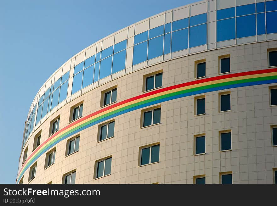 Modern business building with rainbow