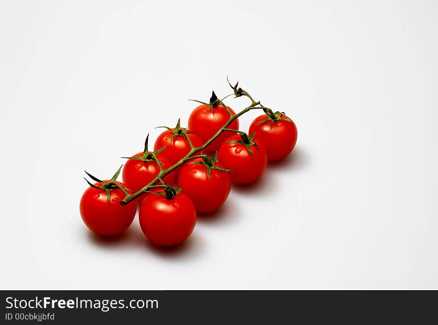 Fresh tomatoes isolated on white