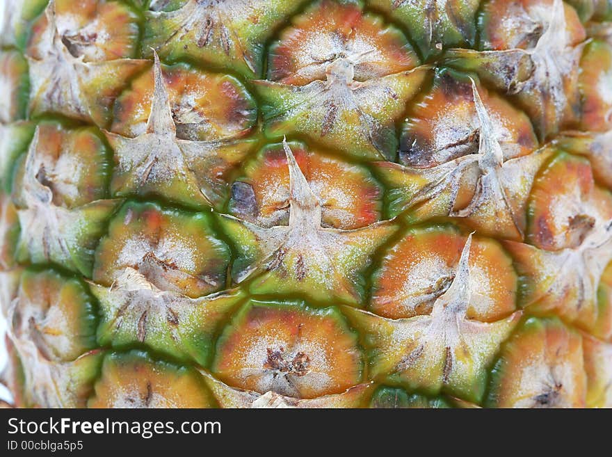 Extreme closeup of the skin on a pineapple, macro shot focus on middle with very high detail. Extreme closeup of the skin on a pineapple, macro shot focus on middle with very high detail