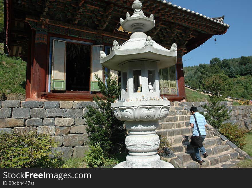 An man worships at a Buddhist temple near Geumsan, South Korea. An man worships at a Buddhist temple near Geumsan, South Korea