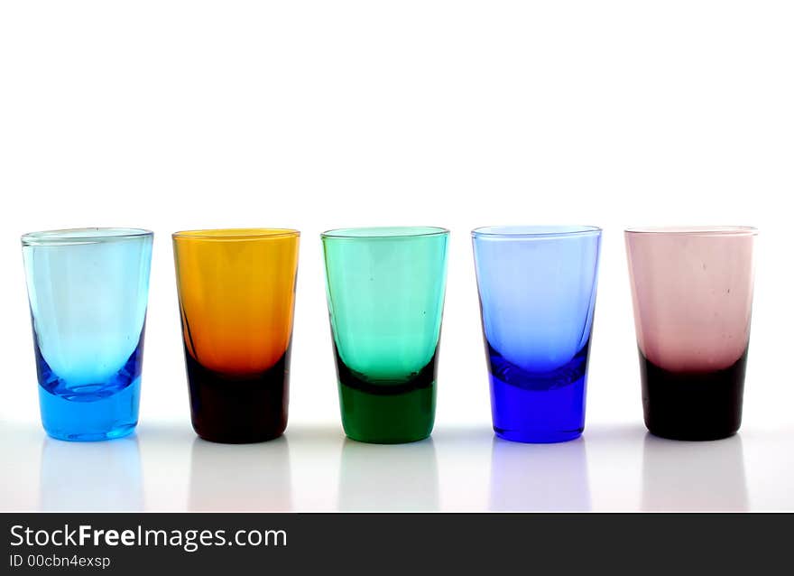 Close up of brightly colored drinking glasses. Close up of brightly colored drinking glasses