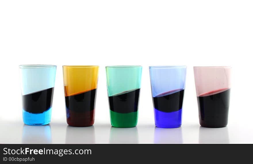 Colored Glasses filled with wine at a strange angle ???. Colored Glasses filled with wine at a strange angle ???