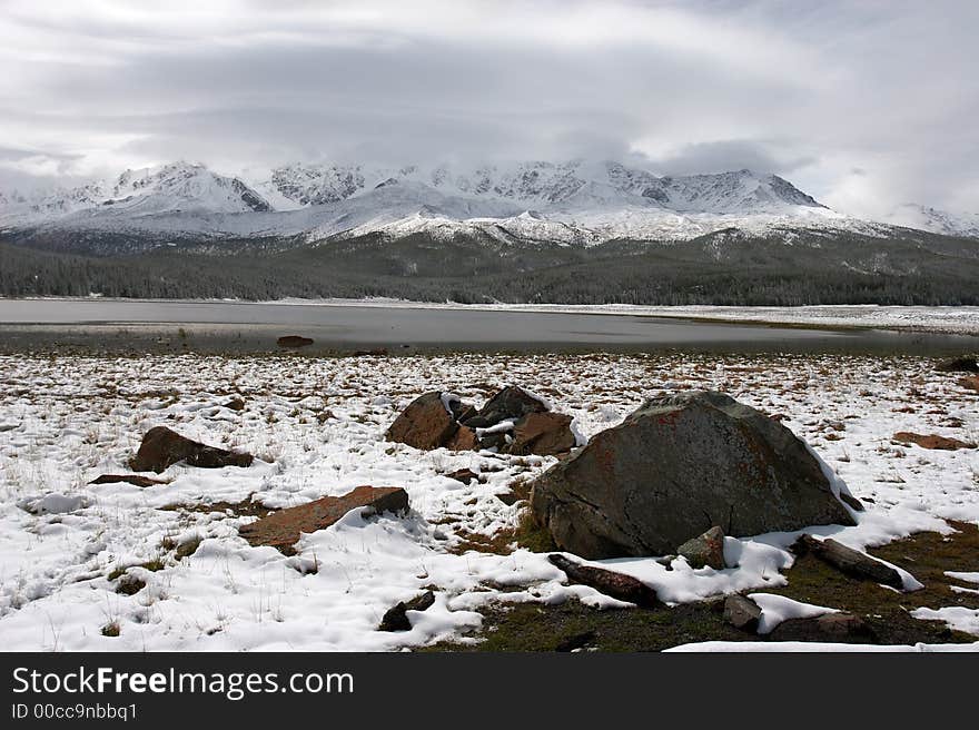 Winter lake and mountains. Altay. Russia.