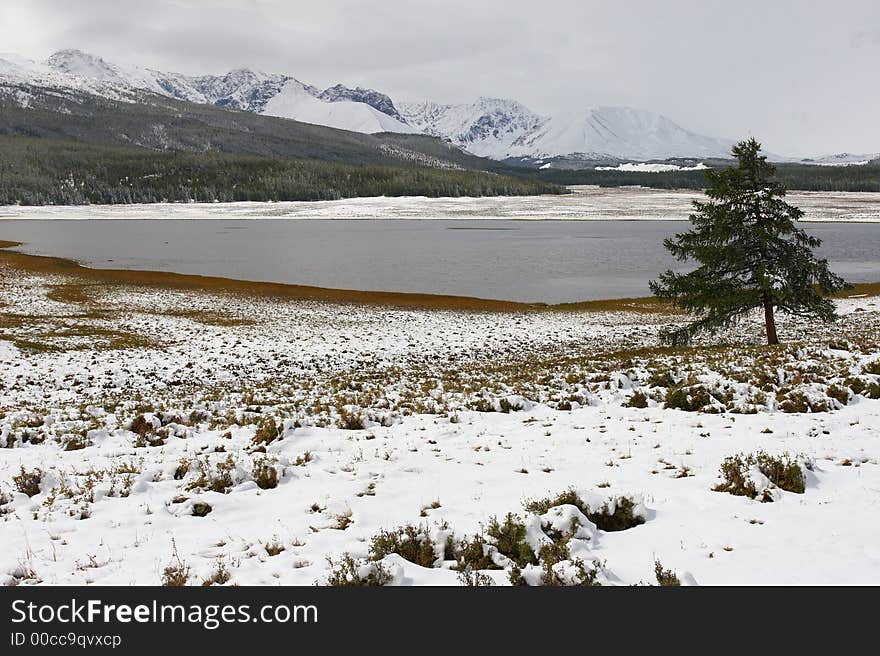 Winter lake and mountains. Altay. Russia.