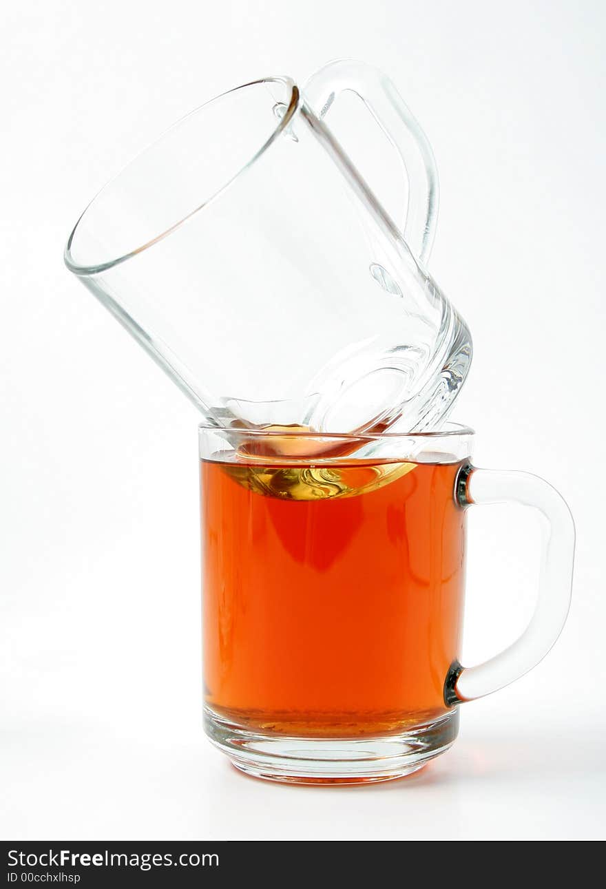 Twoo glass mugs and black tea, Isolated