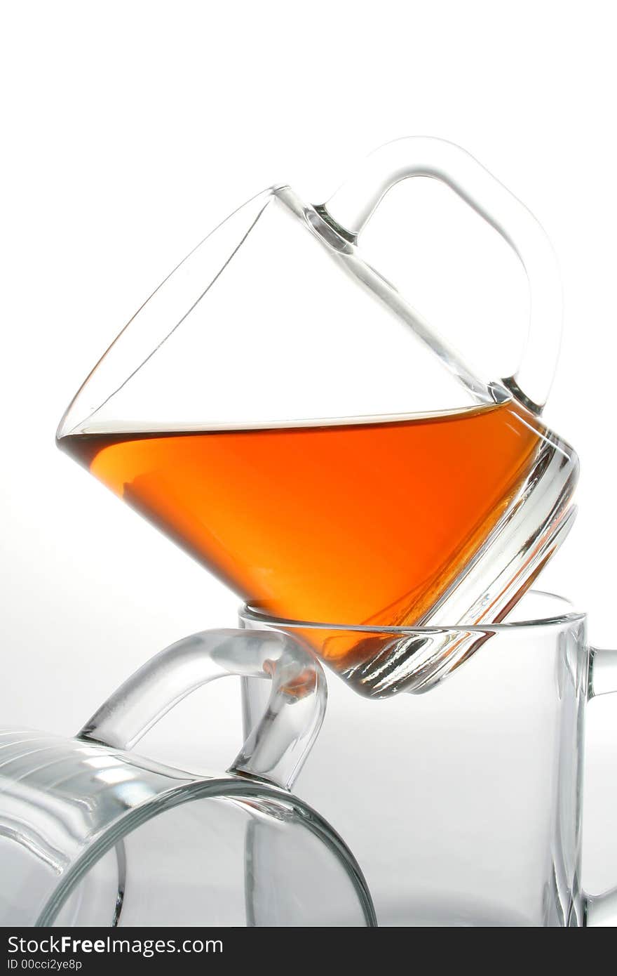 Three glass mugs and black tea, Isolated