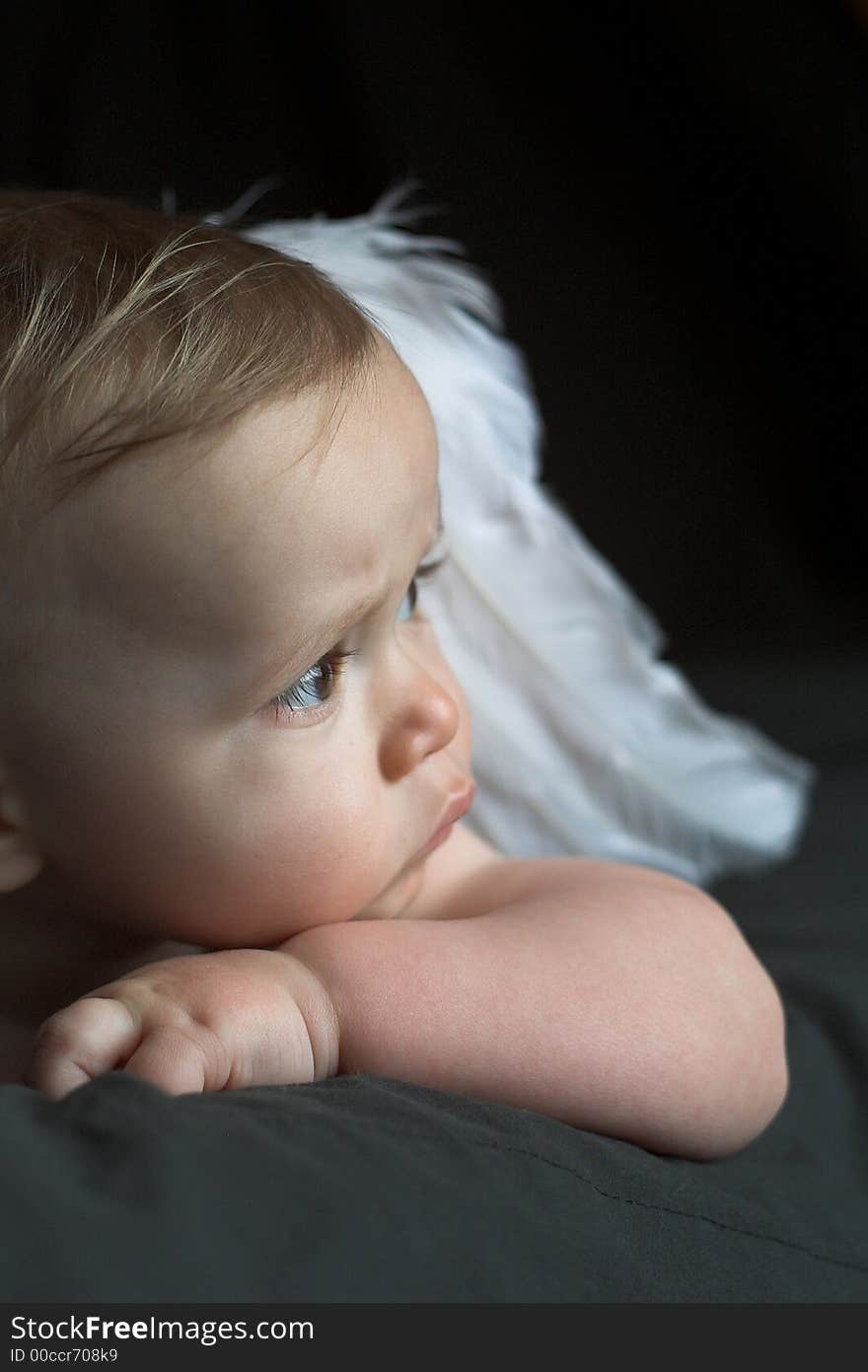 Image of baby wearing angel wings. Image of baby wearing angel wings