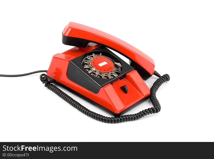 Old styled red telephone isolated over white