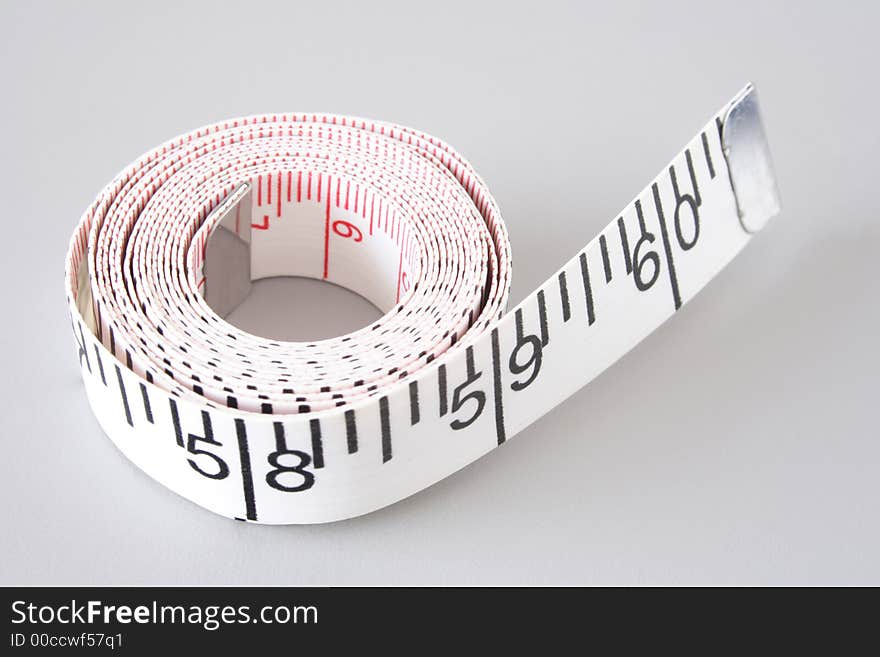 Measuring tape on gray background. Measuring tape on gray background