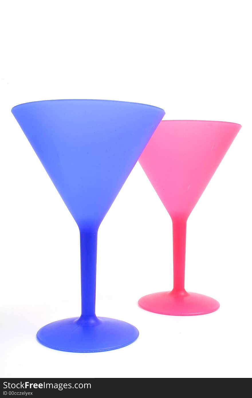 Shot of colorful cocktail glasses on white vertical