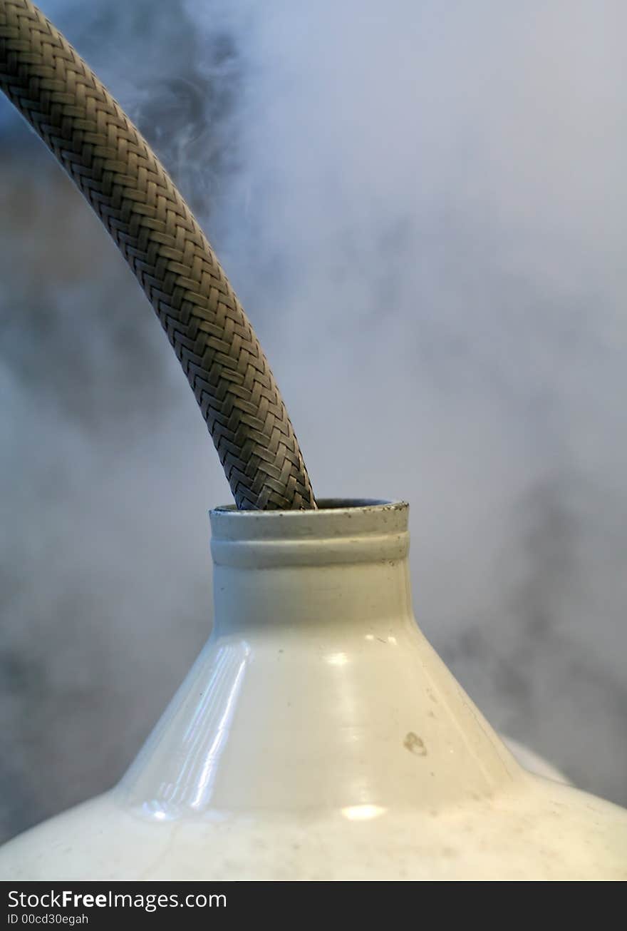 Liquid nitrogen decanted into cryogenic dewar. Liquid nitrogen decanted into cryogenic dewar