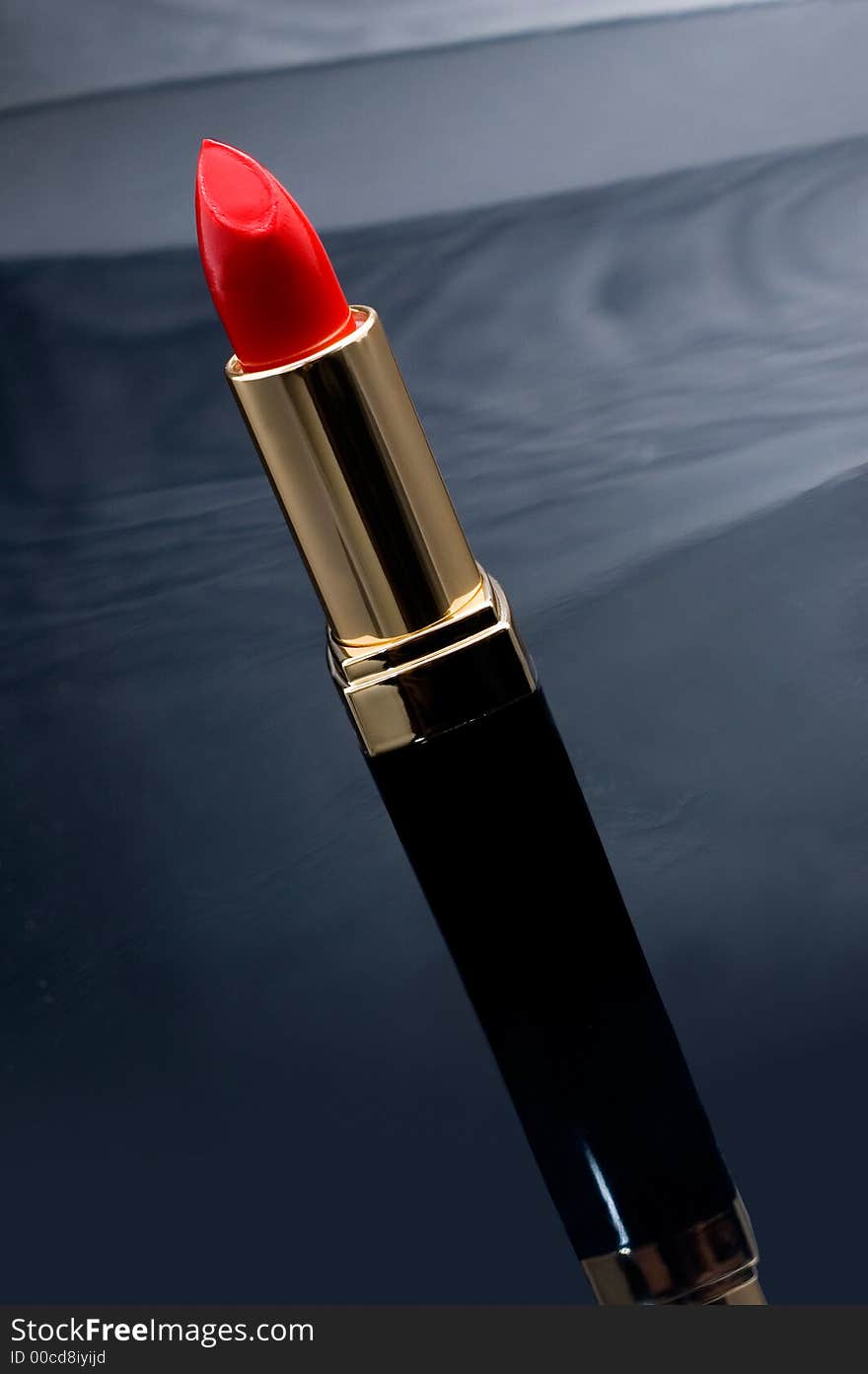 Red lipstick on the reflective background