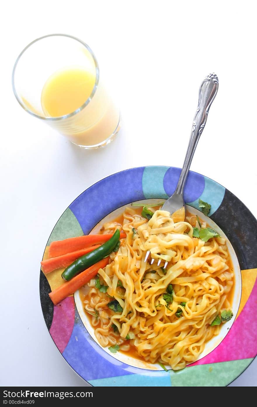 Asian style noodle breakfast and orange juice