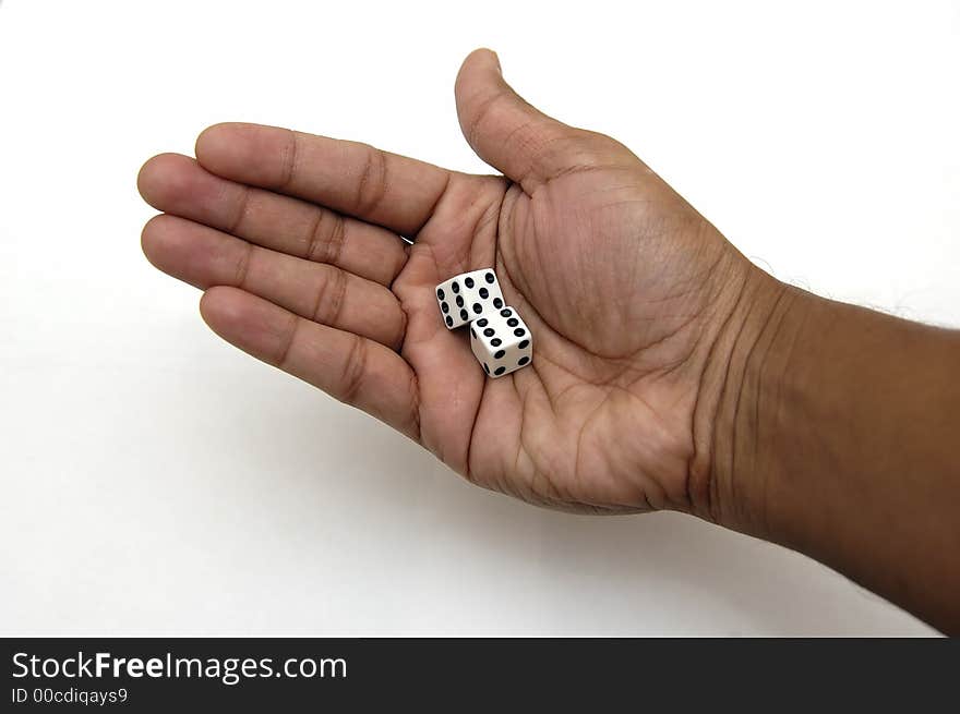 A pair of dice in a hand ready to be rolled