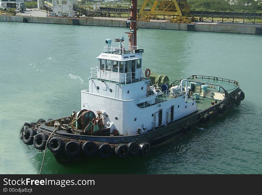 Towboat waiting standby at an industrial harbour