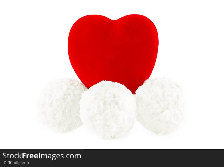 Shot of the red heart on the coconut sweets, on a white background with pretty shadow. Shot of the red heart on the coconut sweets, on a white background with pretty shadow