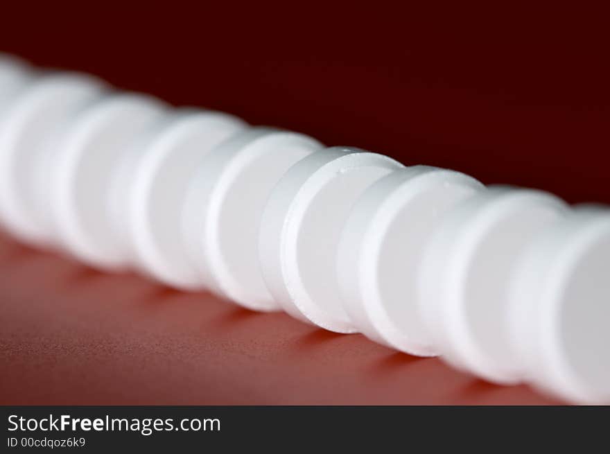 Macro of column of white tablet. Shallow DOF. Macro of column of white tablet. Shallow DOF