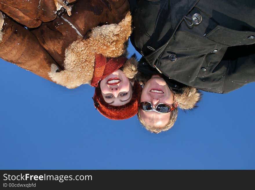 Winter couple against the sky. Winter couple against the sky