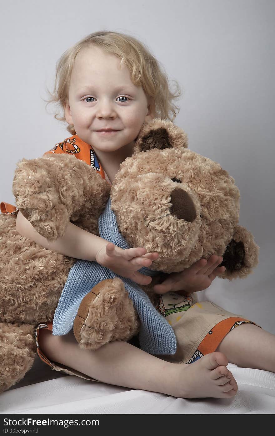 Smiling boy with teddy bear