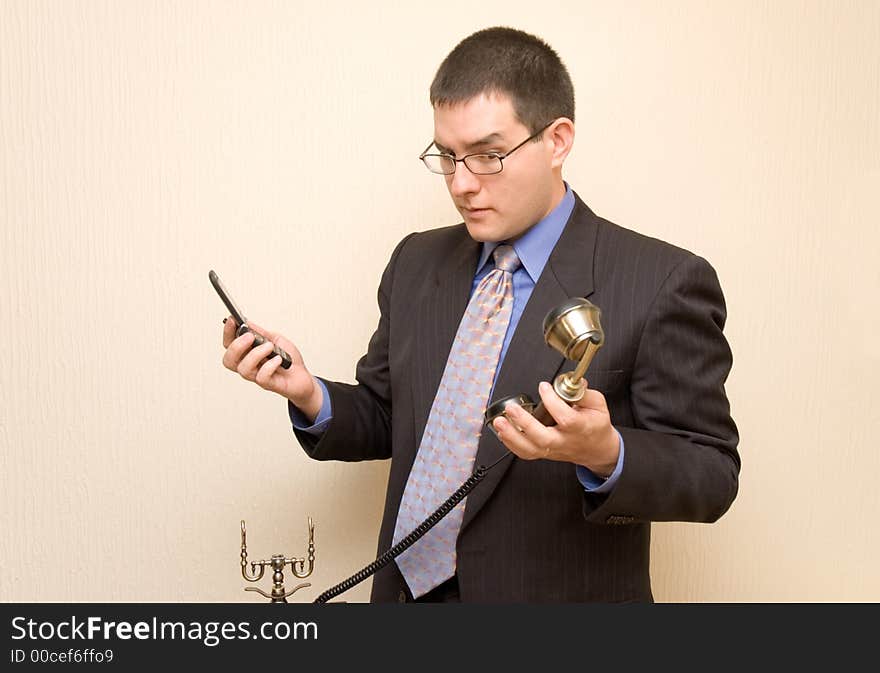 Business Man With Two Phones