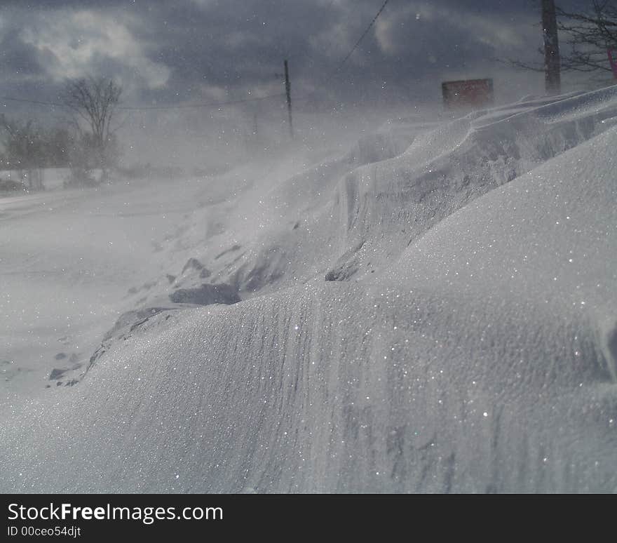 Snow blown by the wind to form a drift. Snow blown by the wind to form a drift.