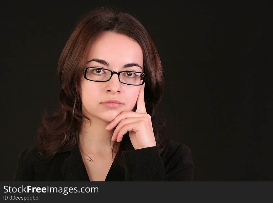 Business woman thinking and giving an idea to a problem, black background