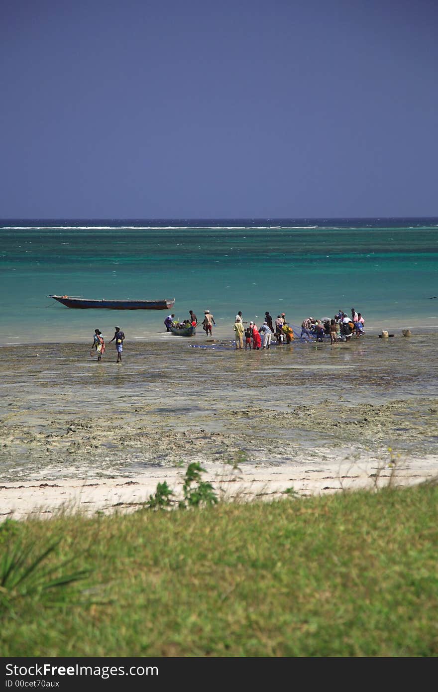 Local people buying fish on the beach