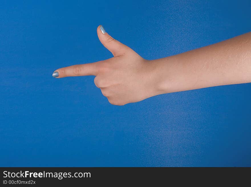 Figure of fingers with blue nacre manicure against blue background. Figure of fingers with blue nacre manicure against blue background