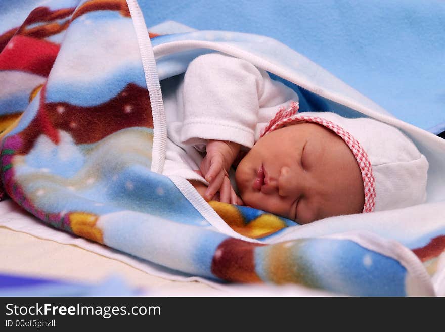 Small new born boy sleeping in the bed. Small new born boy sleeping in the bed