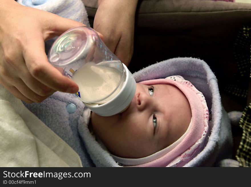 New born baby boy eating his milk. New born baby boy eating his milk