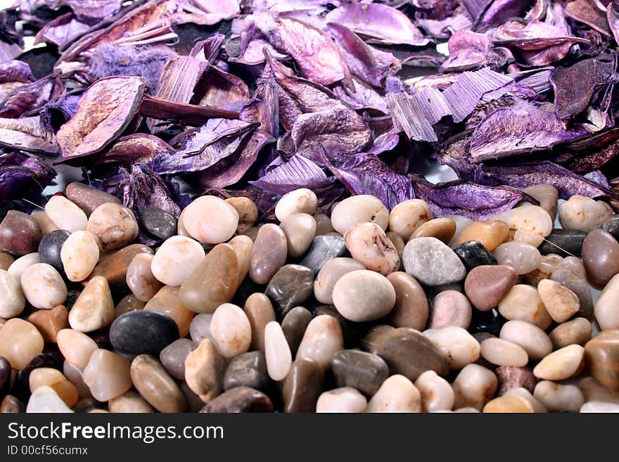 Pot Pourri and polished pebbles creating a line. Pot Pourri and polished pebbles creating a line.