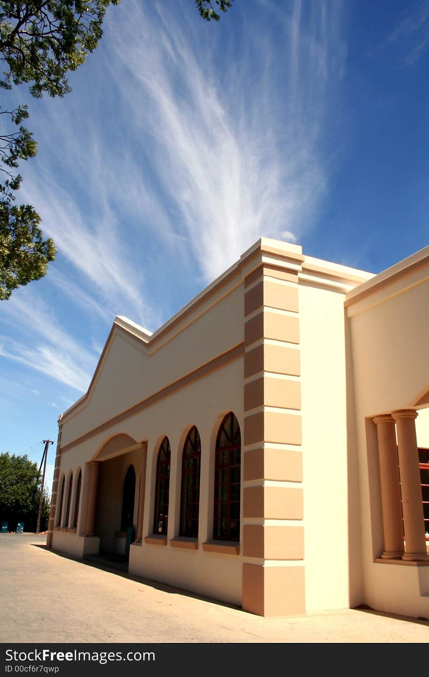 Building with blue sky and white clouds