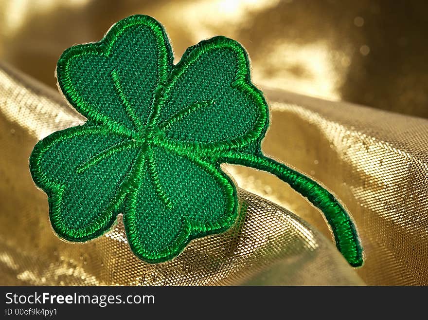 Four leaf clover and shine of gold