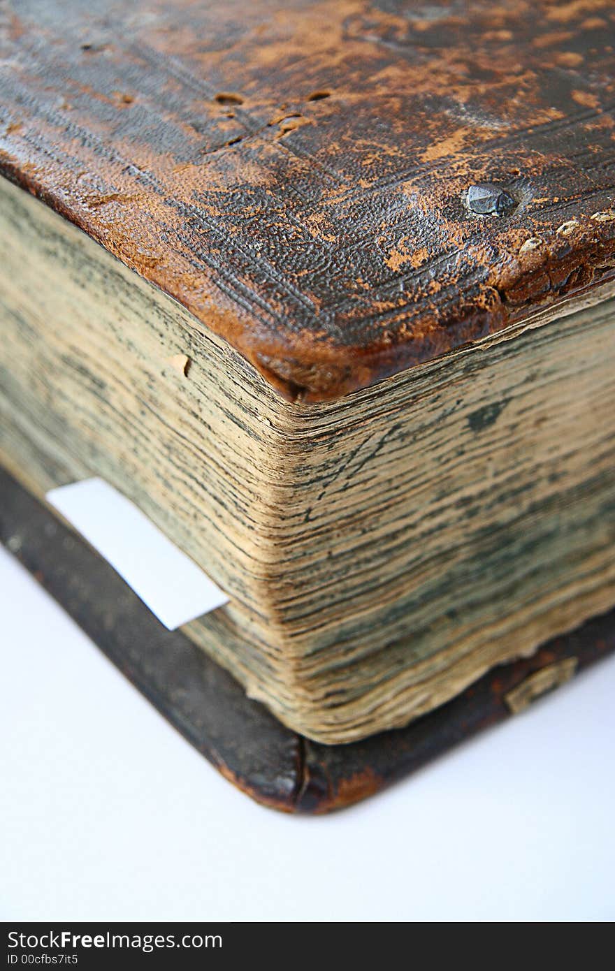 Part of the old big book in leather reliure on a white background. Part of the old big book in leather reliure on a white background.