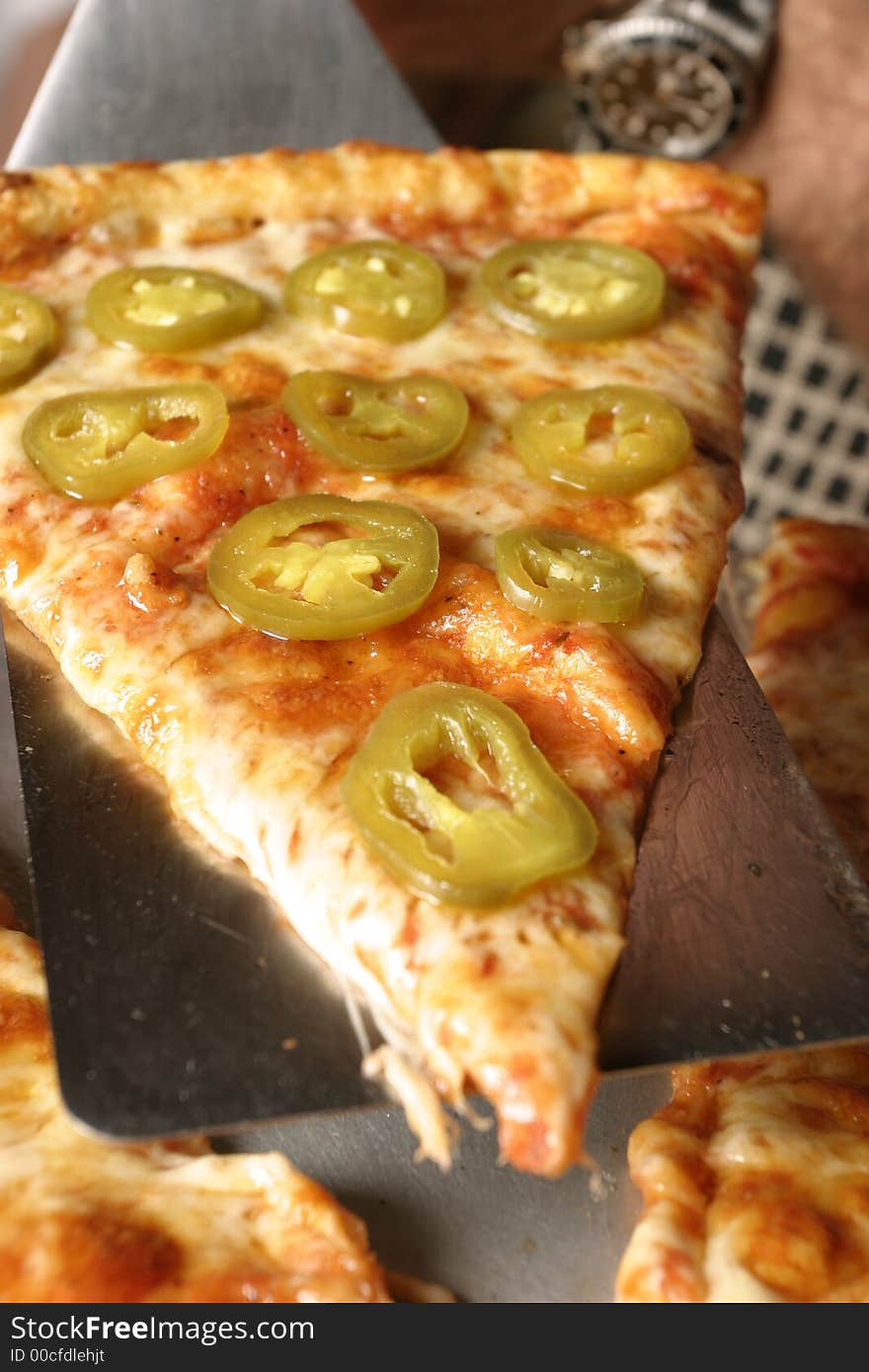 Closeup of a Pepper Pizza slice at an Angle, Closeup. Closeup of a Pepper Pizza slice at an Angle, Closeup