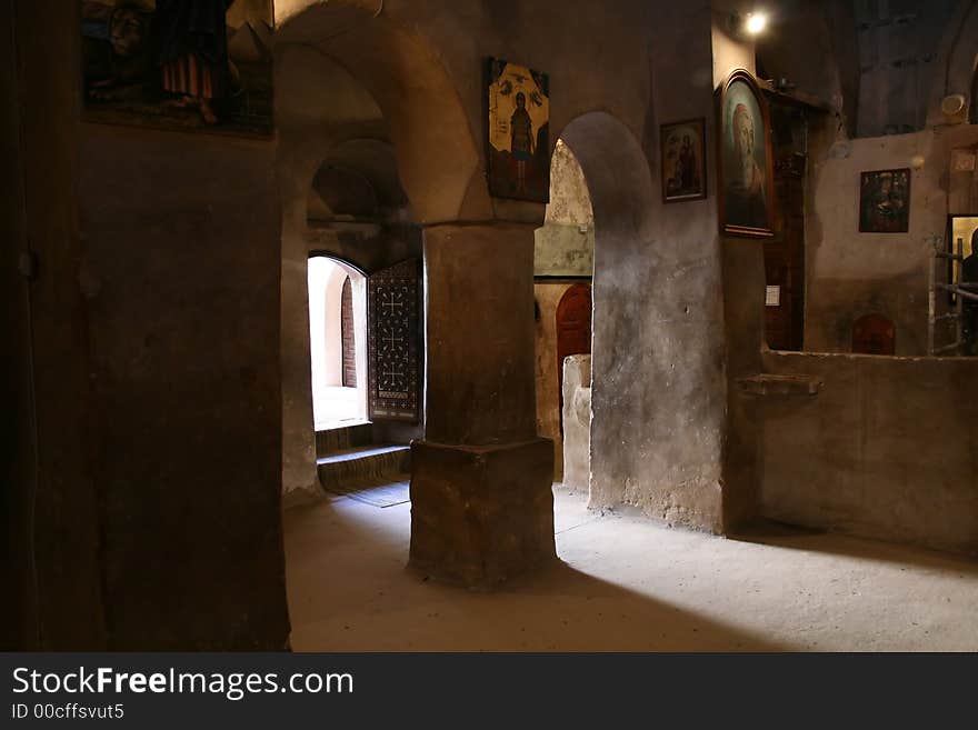 Light going through the door of an old church in one of the coptic orthodox monasteries located within the deserts of Egypt. Light going through the door of an old church in one of the coptic orthodox monasteries located within the deserts of Egypt.