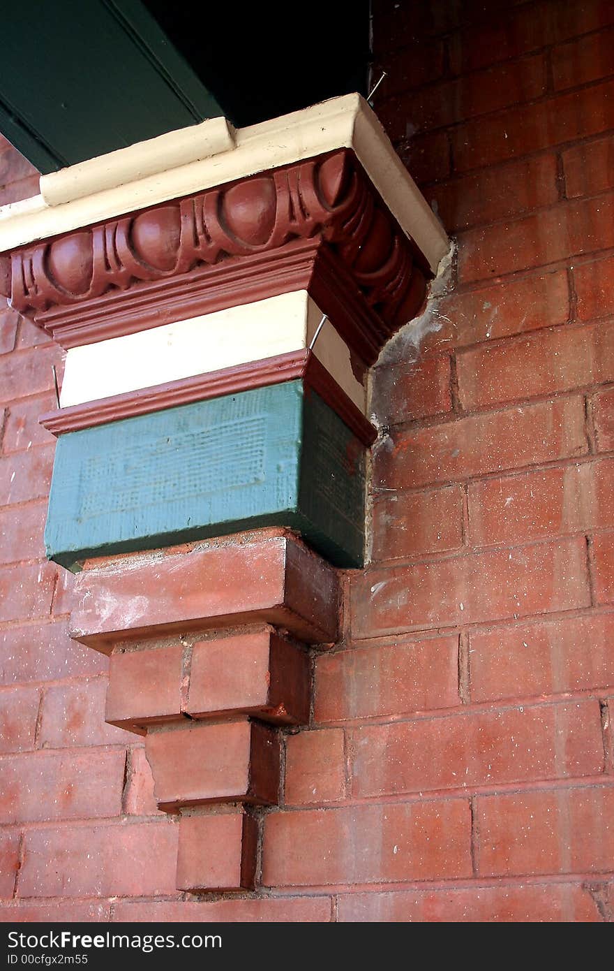 A porch support on an older apartment building