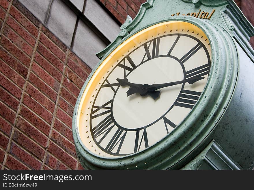 Green Street Clock with Roman Numberal Numbers