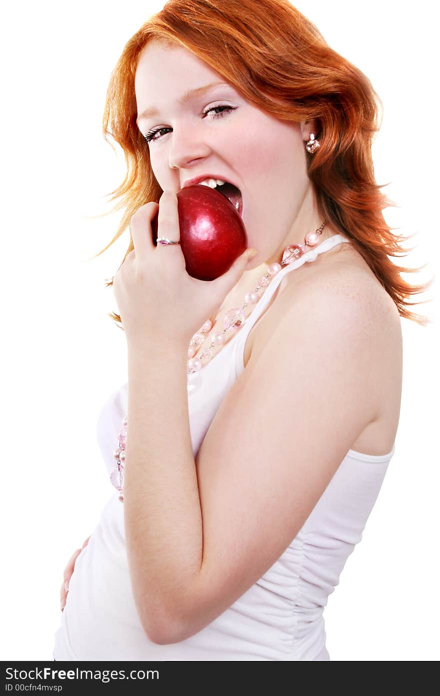 Young beautiful sexy red smiling woman with apple on the white background. Young beautiful sexy red smiling woman with apple on the white background